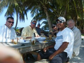 Men eating at a table outside in Corozol, Belize – Best Places In The World To Retire – International Living